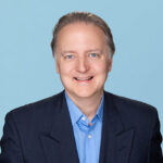 Photograph of Unlock's CEO Jim Riccitelli, looking at the camera and smiling.