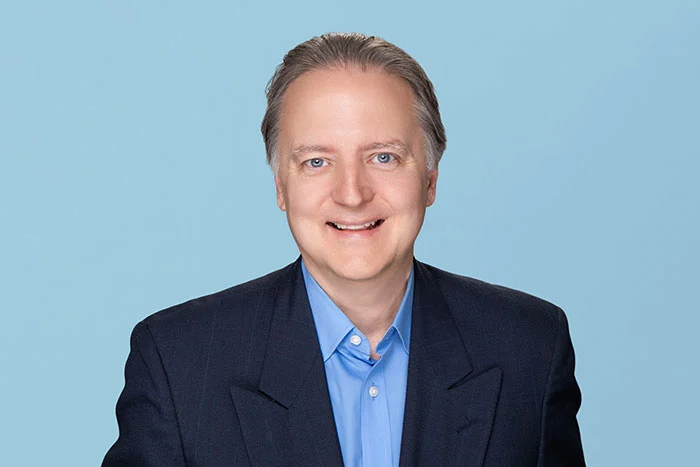 Photograph of Unlock's CEO Jim Riccitelli, looking at the camera and smiling.