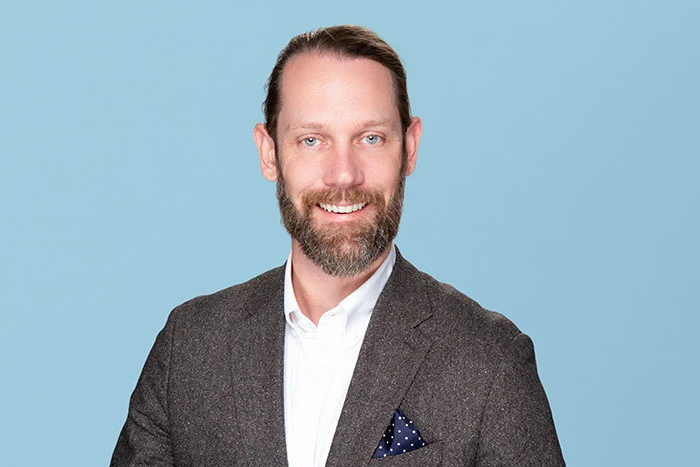 Photograph of Unlock's Chief Operating Officer Paul Tucker, looking at the camera and smiling.